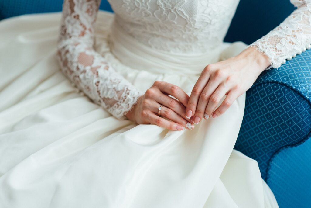 dress up the bride in a wedding dress with corset and lacing