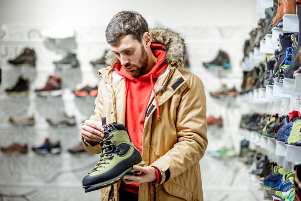 Man choosing shoes for hiking